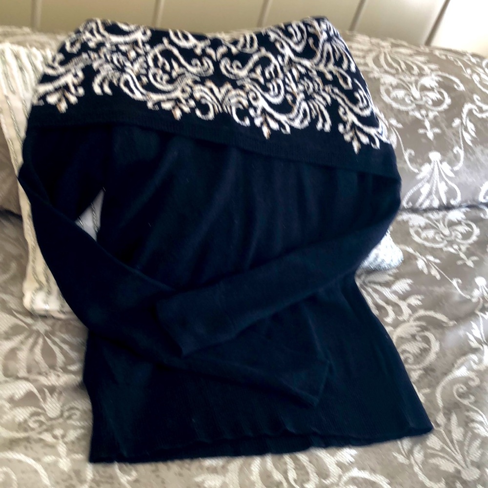 Black sweater with shoulder cowl neck with cream accents and gold threads